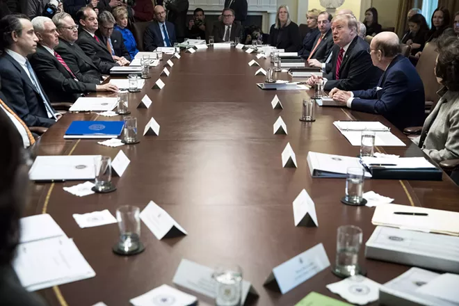 President Donald Trump speaks to reporters during a cabinet meeting at the White House on Tuesday, Feb. 12, 2019. Trump declared that he is “not happy” about the bipartisan border security compromise negotiated by congressional leaders but would not say whether he would sign it or veto it before another government shutdown hits at midnight Friday. - SARAH SILBIGER/THE NEW YORK TIMES