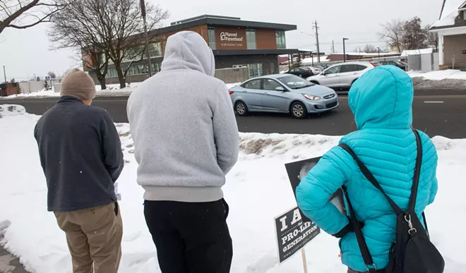 Two Catholic seminarians and a Catholic parishioner pray the Rosary of the Unborn outside of Planned Parenthood in February. - DANIEL WALTERS PHOTO