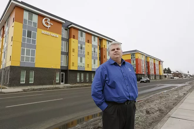 Catholic Charities CEO Rob McCann stands in front of Buder Haven, one of Catholic Charities' projects to house the homeless. Catholic Charities has been a major partner wtih the city of Spokane to fight homelessness, but Daly — a former board member of the Catholic Charities of San Francisco — is wary of involving Catholic organizations too much with government. - YOUNG KWAK PHOTO
