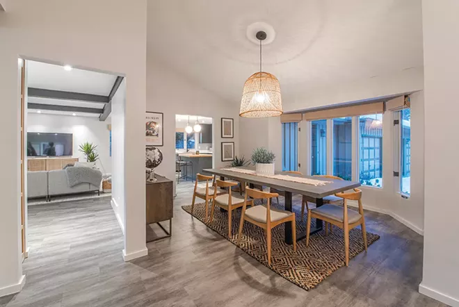 Textures and shadows add interest in the welcoming dining area. The airy quality of the relatively large light fixture keeps it from overpowering the space. - ERICK DOXEY PHOTO