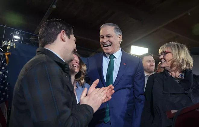 Gov. Jay Inslee is joined by his son Joe, left, and his wife Trudy as he announces his candidacy for the presidency at A&R Solar, an installation company, in Seattle, Wash., on Friday, March 1, 2019. Inslee, a former member of Congress who has made climate change and the environment his signature issues, jumped into the crowded field of 2020 Democratic contenders for president on Friday. - RUTH FREMSON/THE NEW YORK TIMES