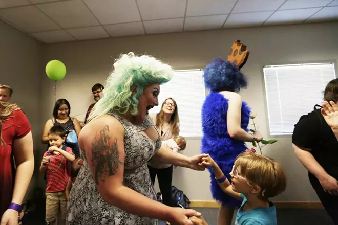 After reading Jane Yolen's Not All Princesses Dress in Pink, Tirrany Hex, left, dances with 6-year-old Klara Wisner during Drag Queen Story Hour at Spokane Public Library South Hill. - YOUNG KWAK