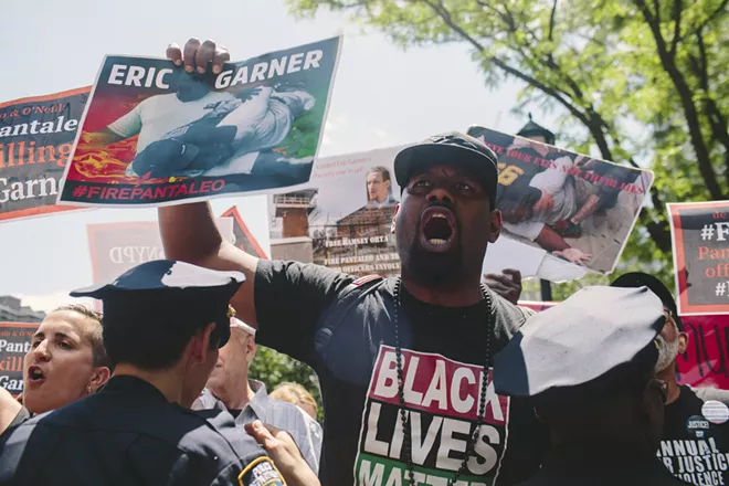 Protesters outside police headquarters in New York during the departmental disciplinary trial of Officer Daniel Pantaleo on June 6, 2019. The Justice Department will not bring federal charges against Pantaleo in the death of Eric Garner, ending a yearslong inquiry into a case that sharply divided officials and prompted national protests over excessive force by the police, according to two people briefed on the decision on Tuesday, July 16, 2019. - GABRIELA BHASKAR/THE NEW YORK TIMES