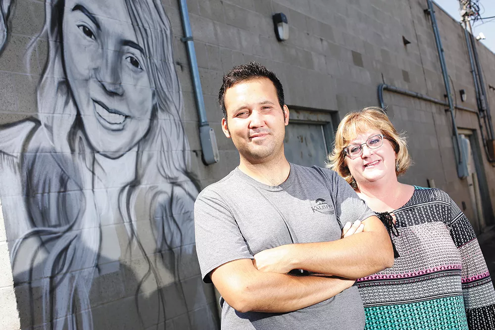 Artist Cody Peone and Garland Business District President Julie Shepard-Hall (left), along with several of the district's existing murals. - YOUNG KWAK PHOTO