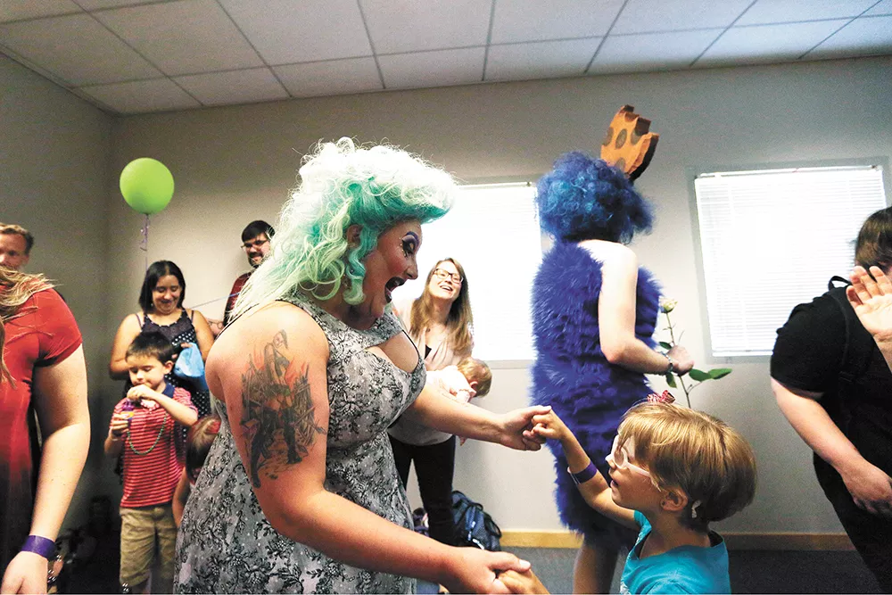 Tirrany Hex, left, dances with 6-year-old Klara Wisner during Drag Queen Story Hour at the Spokane Public Library South Hill. - YOUNG KWAK PHOTO