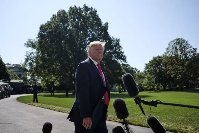 President Donald Trump speaks to reporters outside the White House, before boarding Marine One in Washington, on Friday, Aug. 9, 2019. Trump was headed to a political fund-raiser in Southampton, N.Y., followed by a vacation at his golf club in New Jersey. - GABRIELLA DEMCZUK/THE NEW YORK TIMES