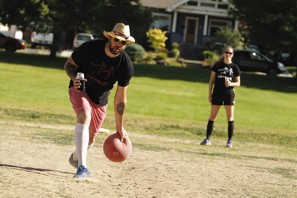 Sole Fighters' Isaac Gordon pitches during a BigFoot KickBall League game against Fresh Pints of Ball-Air at Grant Park. - YOUNG KWAK PHOTO