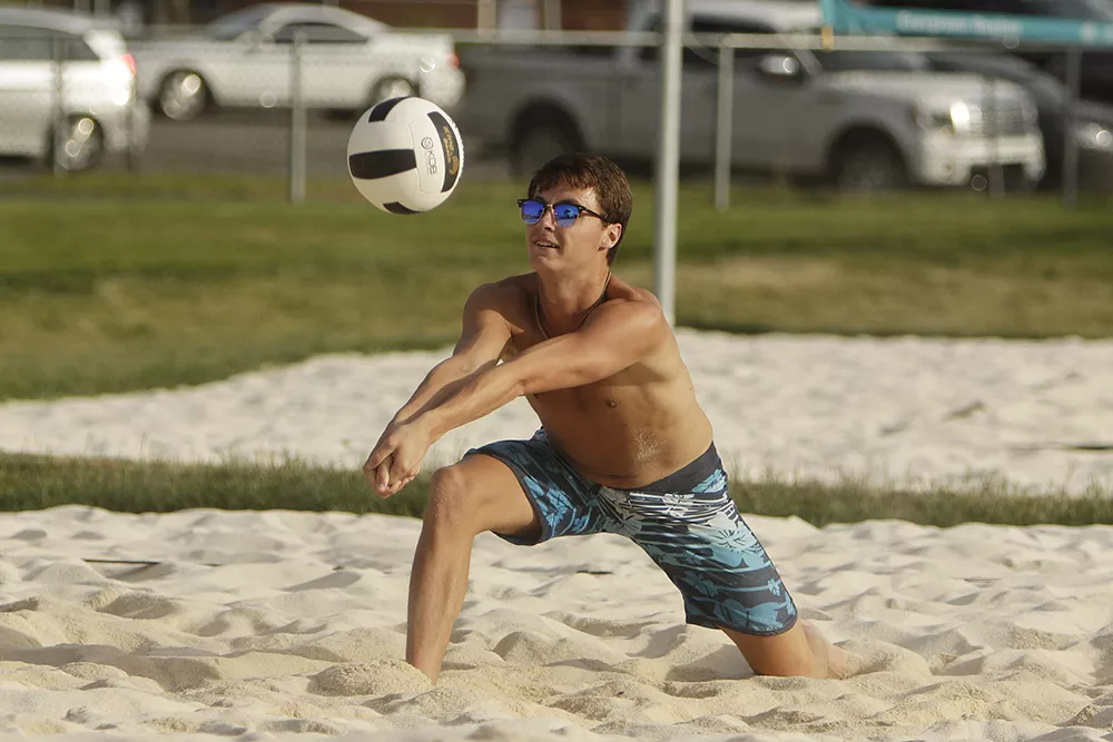 Joseph Parry receives the ball during an Evergreen Region Volleyball Association league beach volleyball game at Browns Park in Spokane Valley. - YOUNG KWAK PHOTO