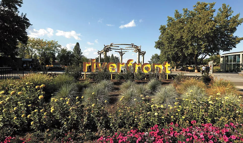 New sunshine-yellow signs greet you at either end of the Howard Street Promenade. You could even say the Harold Balazs Rotary Fountain transcends your entrance into Riverfront Spokane. - YOUNG KWAK PHOTO