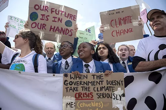 Students protest of climate change inaction in Cape Town, South Africa, Sept. 20, 2019. Anxious about their future on a hotter planet, angry at world leaders for failing to arrest the crisis, thousands of young people began pouring into the streets on Friday for a day of global climate protest. - SYDELLE WILLOW SMITH/THE NEW YORK TIMES