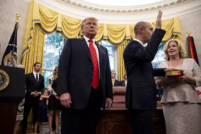 President Donald Trump glances around the Oval Office during the swearing-in of his new labor secretary, Eugene Scalia, on Monday, Sept. 30, 2019. Trump told reporters during the ceremony that the White House is "trying to find out" the identity of the whistle-blower whose claims led Democrats to begin an impeachment inquiry last week, even as the whistle-blower’s lawyers have outlined "serious" safety concerns for their client as Trump has repeatedly targeted him and compared him to a spy. - ANNA MONEYMAKER/THE NEW YORK TIMES