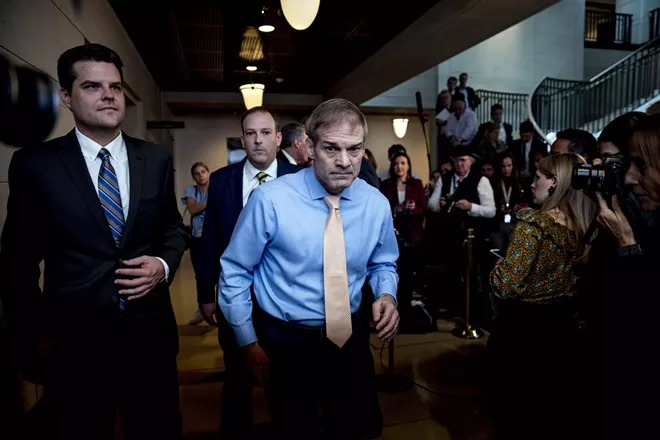 Rep. Jim Jordan (R-Ohio), center, and other Republicans outside of the secure room where impeachment interviews took place on Capitol Hill on Oct. 8, 2019. House Republicans plan to aggressively defend President Donald Trump during impeachment hearings that begin Wednesday, Nov. 13, 2019, by arguing that his efforts to push a foreign leader to announce investigations into his political rivals were legitimate attempts to root out corruption. - ANNA MONEYMAKER/THE NEW YORK TIMES