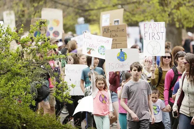 7 year old Theia Garrettson, left, 11 year old Creeley Chanse march on the Centennial Trail in Riverfront park during the March for Science in 2017. - YOUNG KWAK PHOTO