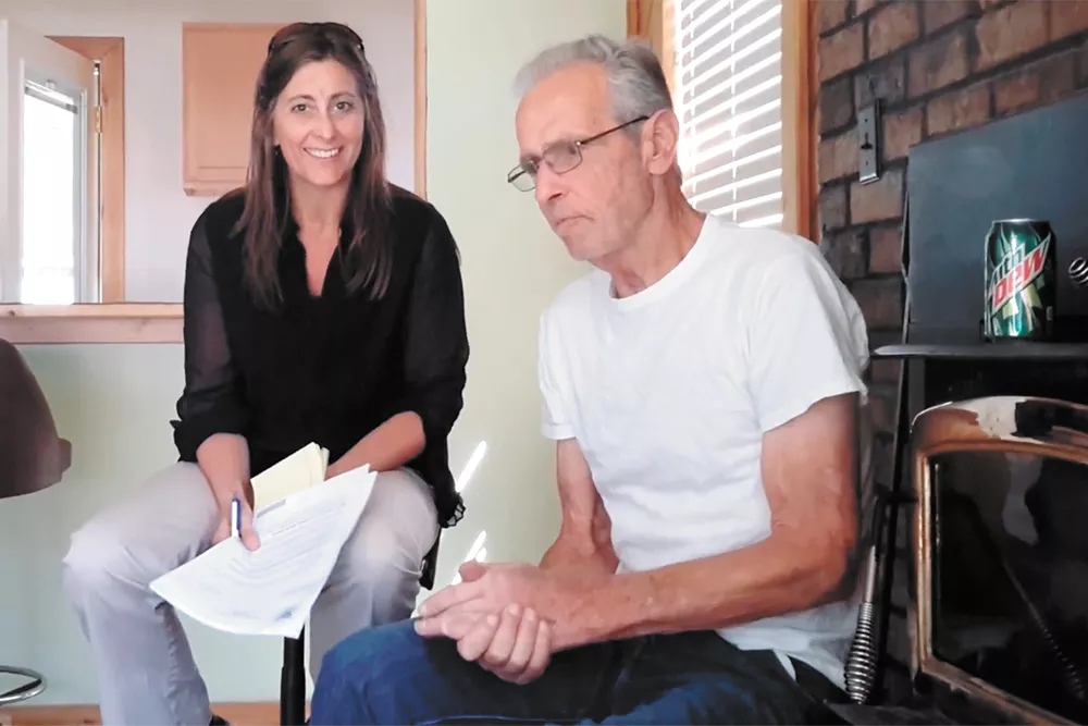 In this YouTube screengrab, Heather Scott sits with Vietnam Vet John Arnold after a rally in support of Arnold's Second Amendment rights.