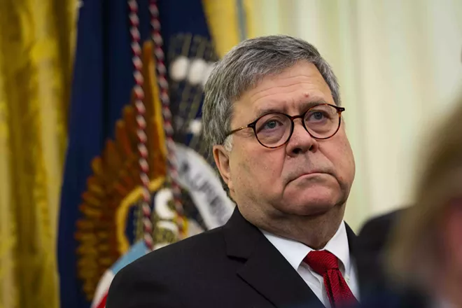 Attorney General William Barr as President Donald Trump makes remarks in the Oval Office at the White House in Washington on Tuesday, Nov. 26, 2019. Barr warned that communities and critics of policing must display more deference or risk losing protection, a stark admonition that underscored the Trump administration’s support for law enforcement amid an ongoing national conversation about police brutality against minorities. - DOUG MILLS/THE NEW YORK TIMES