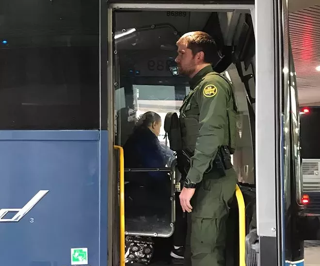 A Border Patrol agent boards a Greyhound bus on Dec. 21, 2019. A Jan. 28 memo specifies that Border Patrol must have the driver's or company's permission. - DAVID BROOKBANK PHOTO