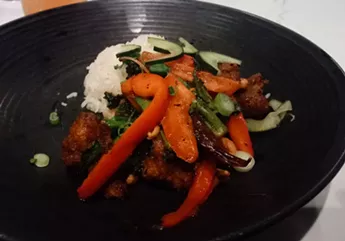 The kung pao cauliflower bowl packs some serious heat, but the pickled cucumbers help cool your mouth. - DAN NAILEN PHOTO