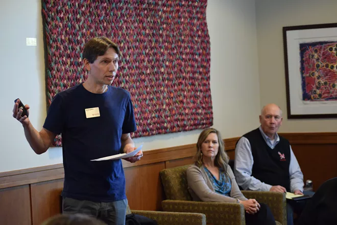 David Syphers, associate professor of physics at EWU, presents a report on athletics spending to the Board of Trustees on Thursday - WILSON CRISCIONE PHOTO