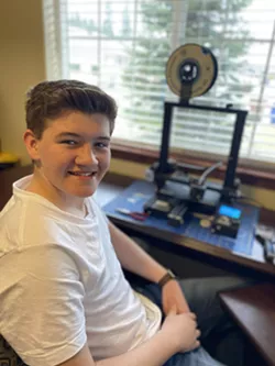Connor Duncan, a Spokane teenager, has started 3D printing face shields for home health care workers like his mom, Christina Duncan. She works for an in-home health care service that helps deliver care to people in their homes, ideally preventing them from needing to go to the hospital. - COURTESY PHOTO
