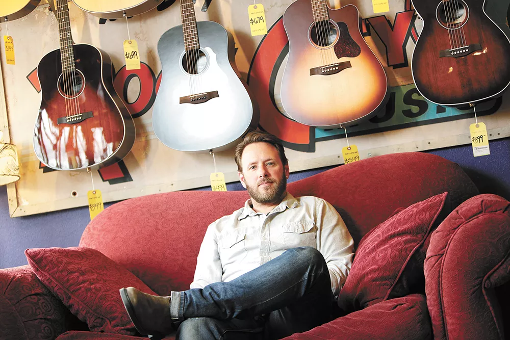 Nate Corning, owner of Mark's Guitar Shop, missed out in the first round of the Payroll Protection Program loan. - YOUNG KWAK PHOTO