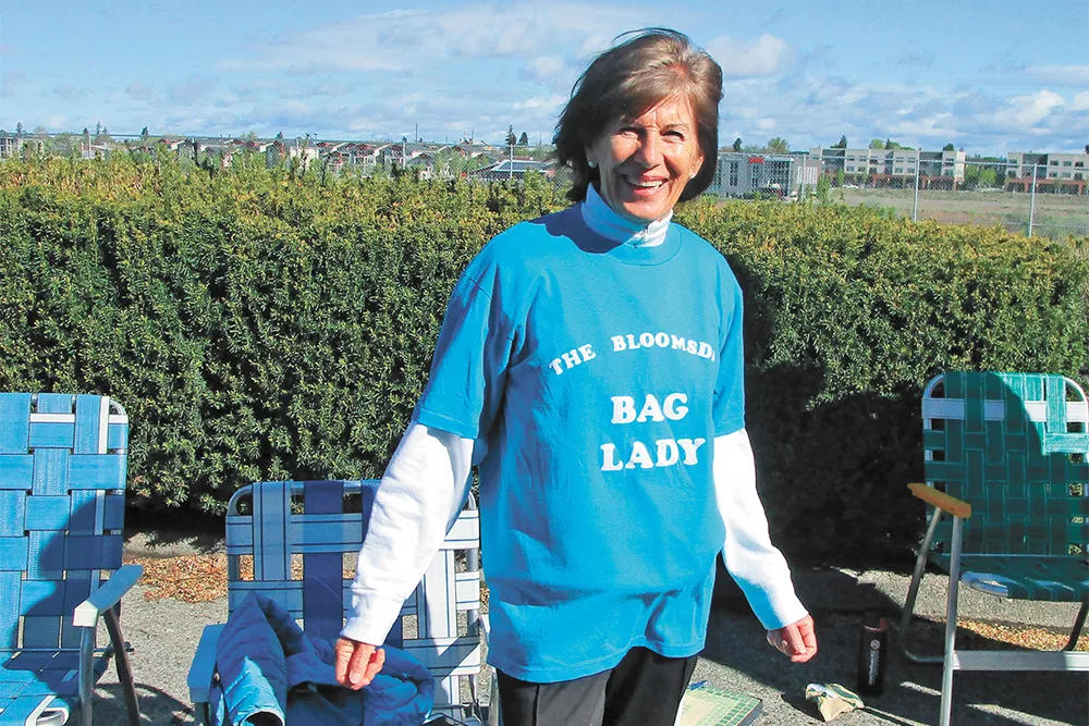 Kathleen Dix cheered on the unofficial Bloomies Sunday, subbing in for her 100-year-old mother. - DAN NAILEN PHOTO