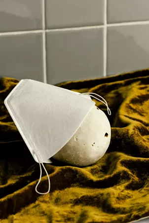 Melitta face mask in Brooklyn on May 6, 2020. Melitta, the German maker of the original paper coffee filter, retooled its production to make masks. - DANIEL DORSA/THE NEW YORK TIMES