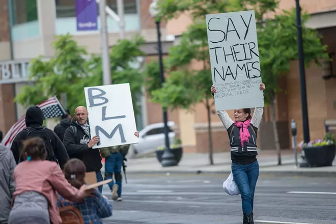 A Spokane protester includes "Otto Zehm," a Spokane man who died after being beaten and hogtied by police in 2017, on the list of names of victims of police violence. - DANIEL WALTERS PHOTO