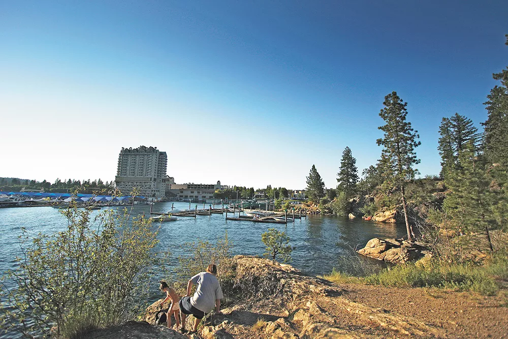 Walking the 2.2-mile loop trail around the base of Tubbs Hill connects you with forested slopes and the shimmering blue waters. - YOUNG KWAK PHOTO