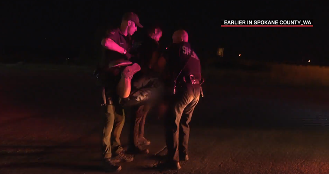 In a Live PD clip titled "Hothead Hogtie," Spokane County sheriff deputies confront a "suspicious person" about why she was walking on the wrong side of the road, and when she remains uncooperative, hog-tie her and lug her to their vehicle. - LIVEPD SCREENCAP
