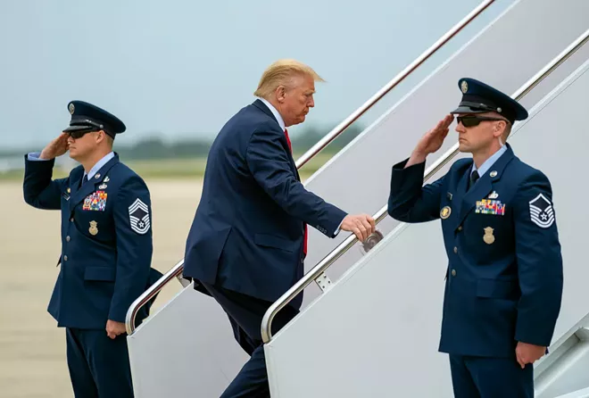 President Donald Trump boards Air Force One at Joint Base Andrews in Maryland, for a day trip to Michigan, on Thursday, May 21, 2020. - DOUG MILLS/THE NEW YORK TIMES