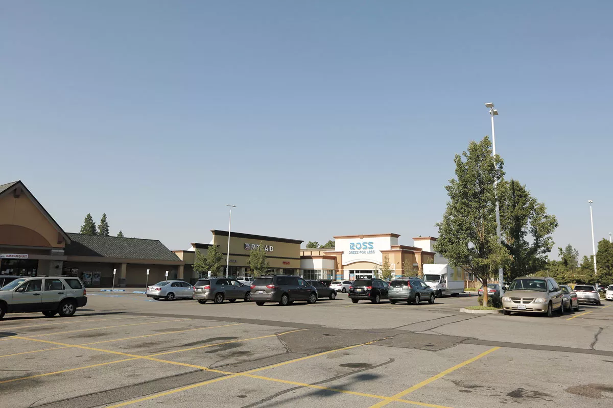 In June, on Spokane's South Hill, an accused shoplifter is confronted by an armed couple who hold her at gunpoint. - YOUNG KWAK PHOTO
