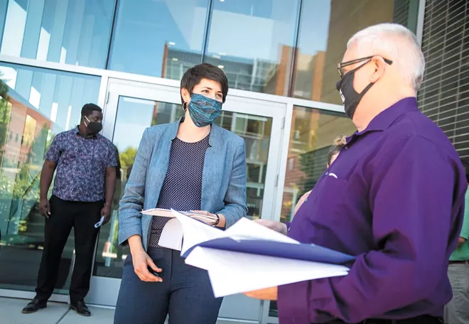 Katie Zinler (center) is a lead organizer with the Spokane Alliance, a coalition of 30 progressive groups. - LIBBY KAMROWSKI PHOTO