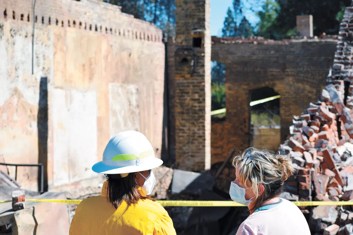 Washington Commissioner of Public Lands Hilary Franz (left) and Malden mayor Chris Ferrell in front of the town's post office, which was completely destroyed in the fire. - WILSON CRISCIONE PHOTO