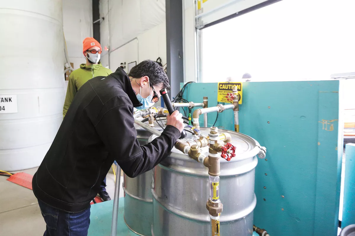 Geologist Ward McDonald checks the water level on a system designed to break down PCBs found in the ground at Kaiser Aluminum. - YOUNG KWAK PHOTO