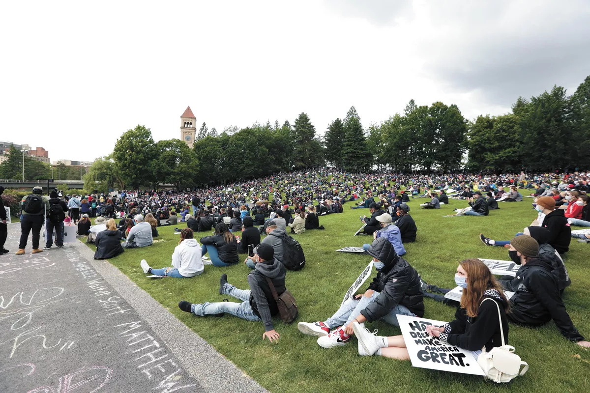 Demonstrators pack into Spokane's Riverfront Park in June. - YOUNG KWAK PHOTO