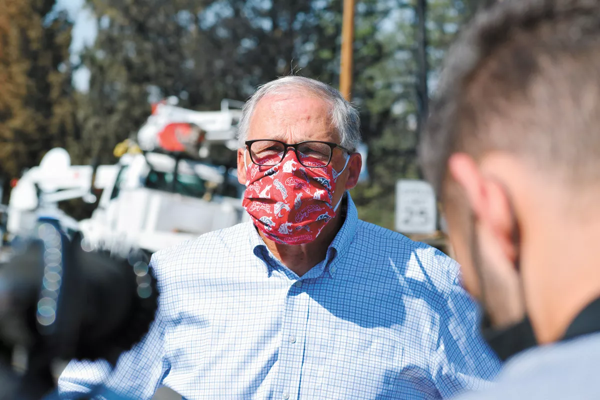 Washington Gov. Jay Inslee, sporting a mask during a visit to Malden in September after the devastasting wildfires. - WILSON CRISCIONE PHOTO