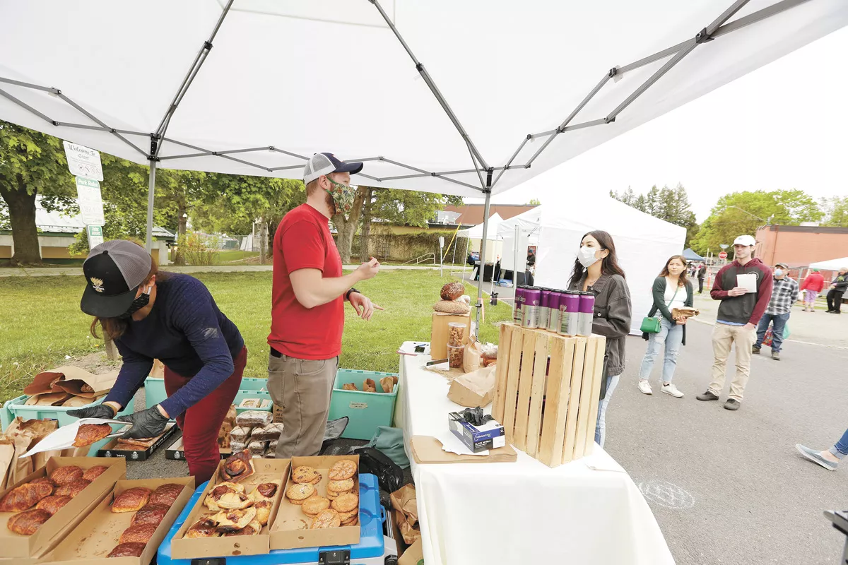 The Grain Shed owner Teddy Benson and Market Coordinator Natalie Weinmeister at the South Perry Thursday Market last year. - YOUNG KWAK PHOTO