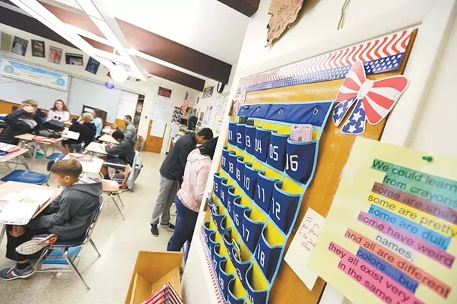 An eighth-grade social studies class at Spokane's Sacajawea Middle School asked kids to clean cotton. - YOUNG KWAK PHOTO