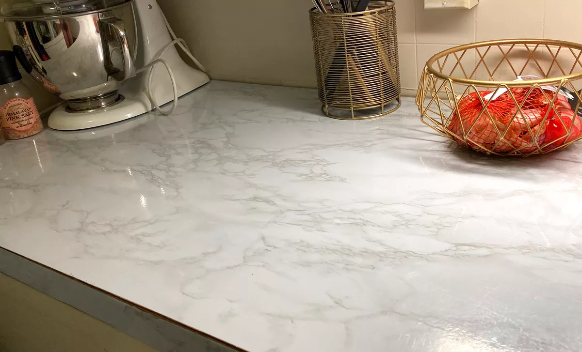 Marble-patterned contact paper is an affordable and easy way to update your countertops. - SAMANTHA WOHLFEIL PHOTO