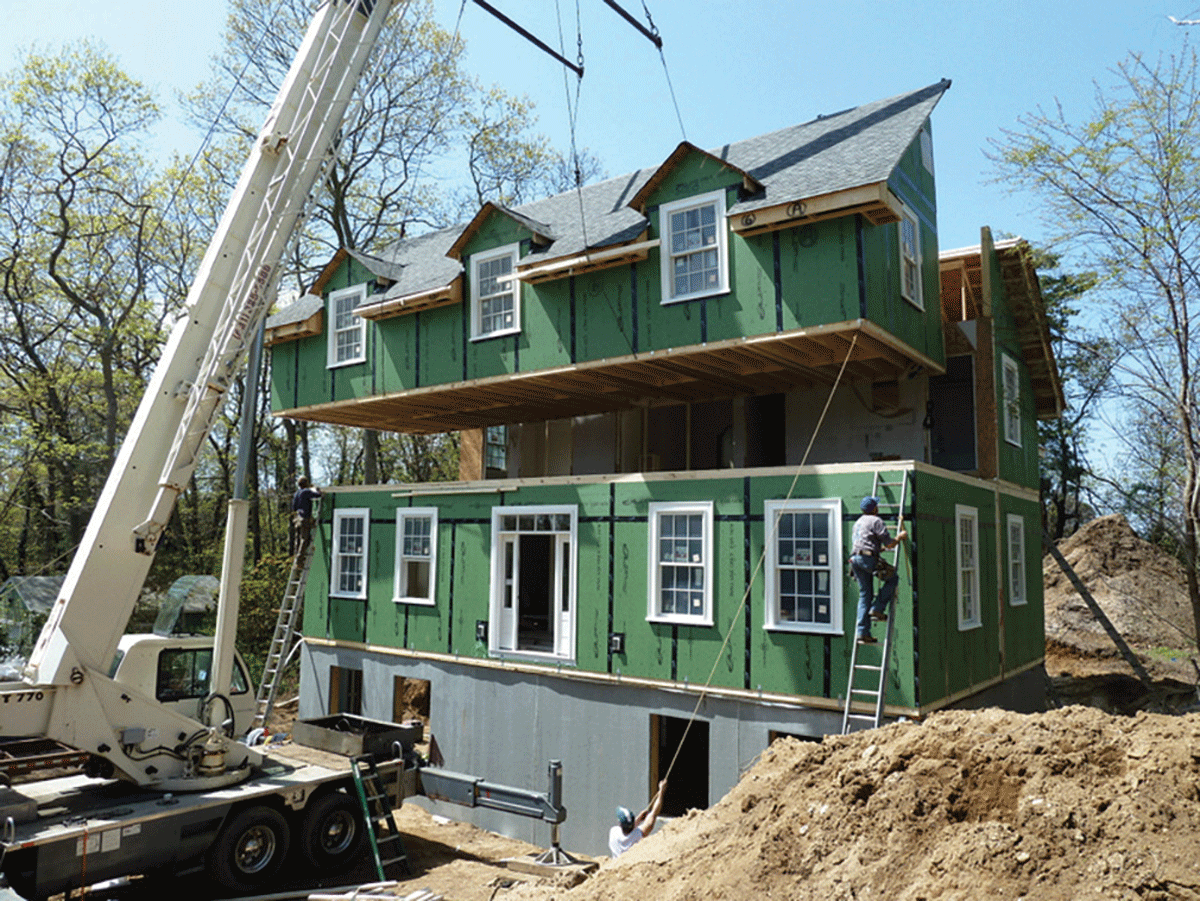 Prefab homes are constructed in sections at a factory and then assembled on site, reducing construction labor costs and saving time. - TYLER SCHMETTERER/MOD X PHOTO