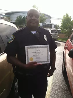 Officer Curtis Tucker, later accused by multiple women of domestic abuse, received a certificate of appreciation from the YWCA in 2013 - COURTESY