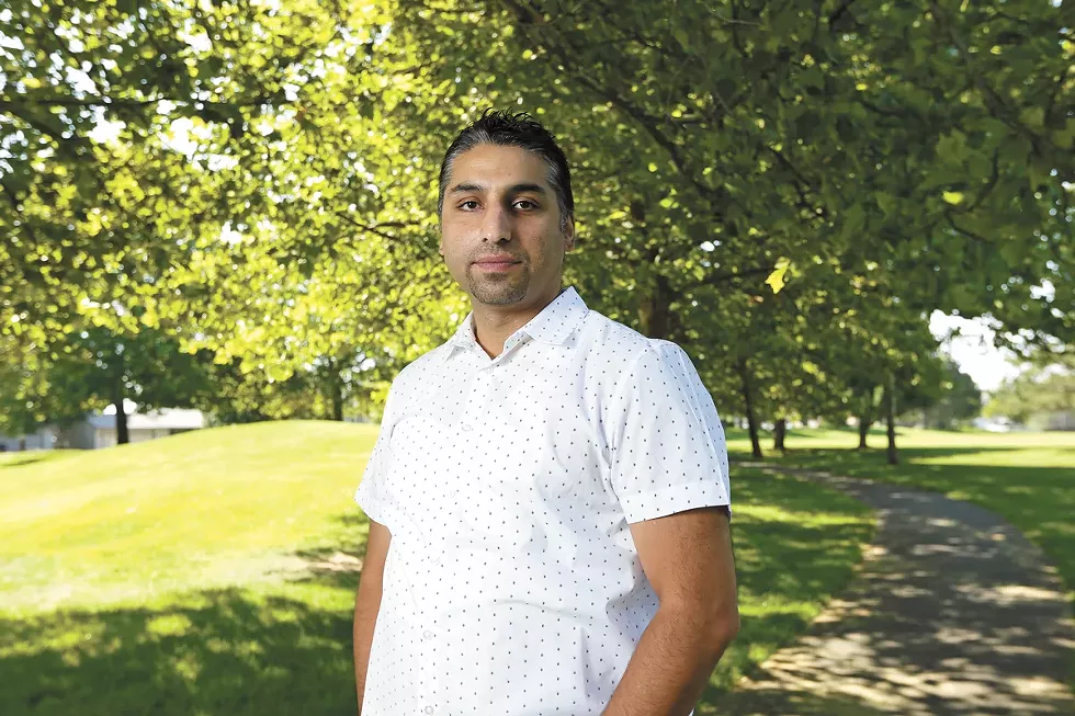 World Relief Community Ambassador Kazim Abdullahi, who came to Spokane on a Special Immigrant Visa eight years ago, says America’s withdrawal does not mean the end of the violence. “It’s the beginning of the war,” he says. - YOUNG KWAK PHOTO