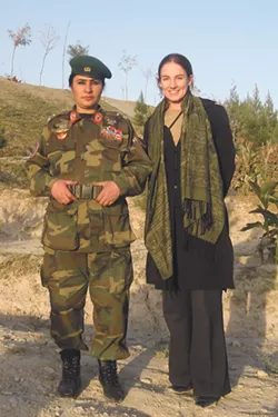 Civilian counternarcotics advisor Eleanor Baumgartner (right) with Brigadier General Khatool Mohammadzai, the first female paratrooper in Afghanistan. - COURTESY OF ELEANOR BAUMGARTNER