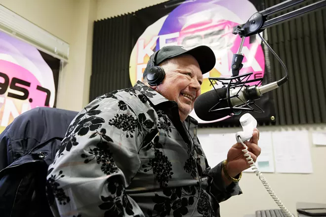 Rafael Cárdenas interviews Latinos en Spokane co-founder Jennyfer Mesa over the phone during La Voz del Pueblo. - YOUNG KWAK PHOTO