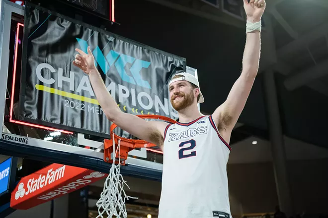 Drew Timme is all smiles after cutting a piece of net from Gonzaga's WCC title-clinching victory against Santa Clara on Feb. 19, 2022, at the McCarthey Athletic Center. - ERICK DOXEY PHOTO