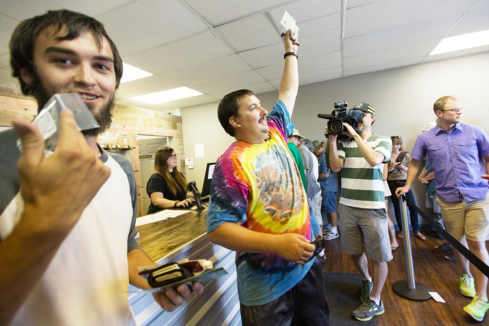 Mike Boyer dressed the part to become Spokane's first legal pot buyer at Spokane Green Leaf in 2014. - YOUNG KWAK PHOTO