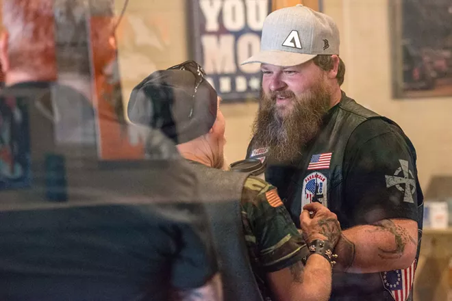 Panhandle Patriot biker Justin "The Judge" Allen (right) speaks with Michael "Viper" Birdsong at LYFE Coffee Roasters & Public House last month. - DANIEL WALTERS PHOTO