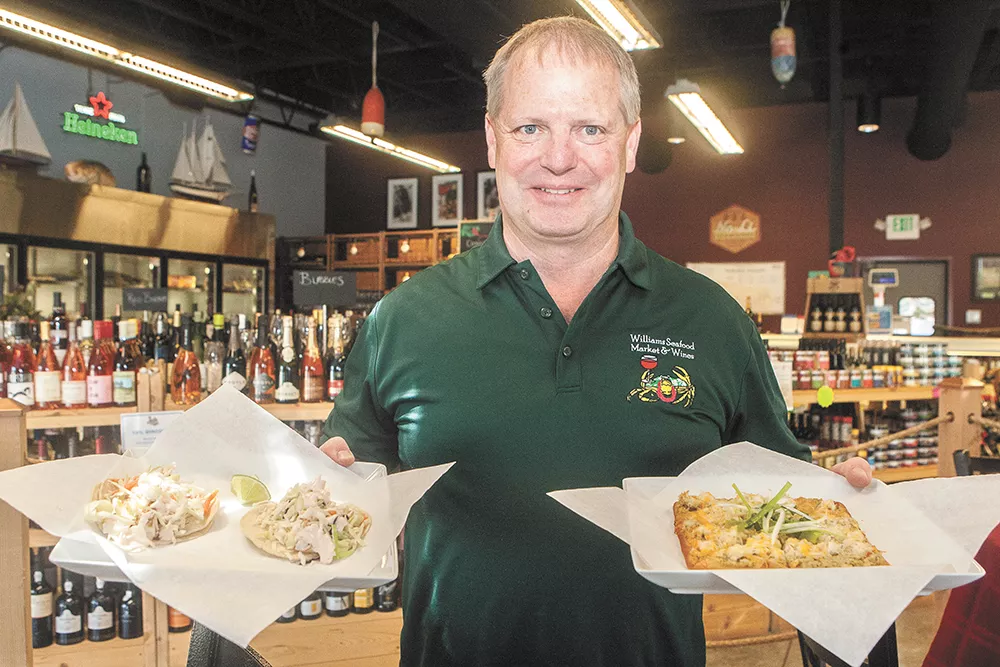 Williams Seafood Market owner Mike Offield with a couple dishes from the store's recently added restaurant. - MEGHAN KIRK