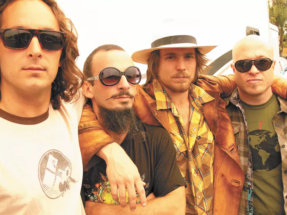 Lukas Nelson (in the hat) and Promise of the Real recorded an album with Neil Young and are now on tour with him.