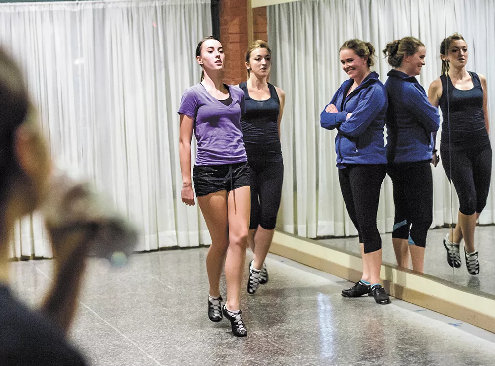 Irish dance teacher Caitlin Truslter, in blue, instructs her championship dancers at her South Perry District studio. - JEFF FERGUSON